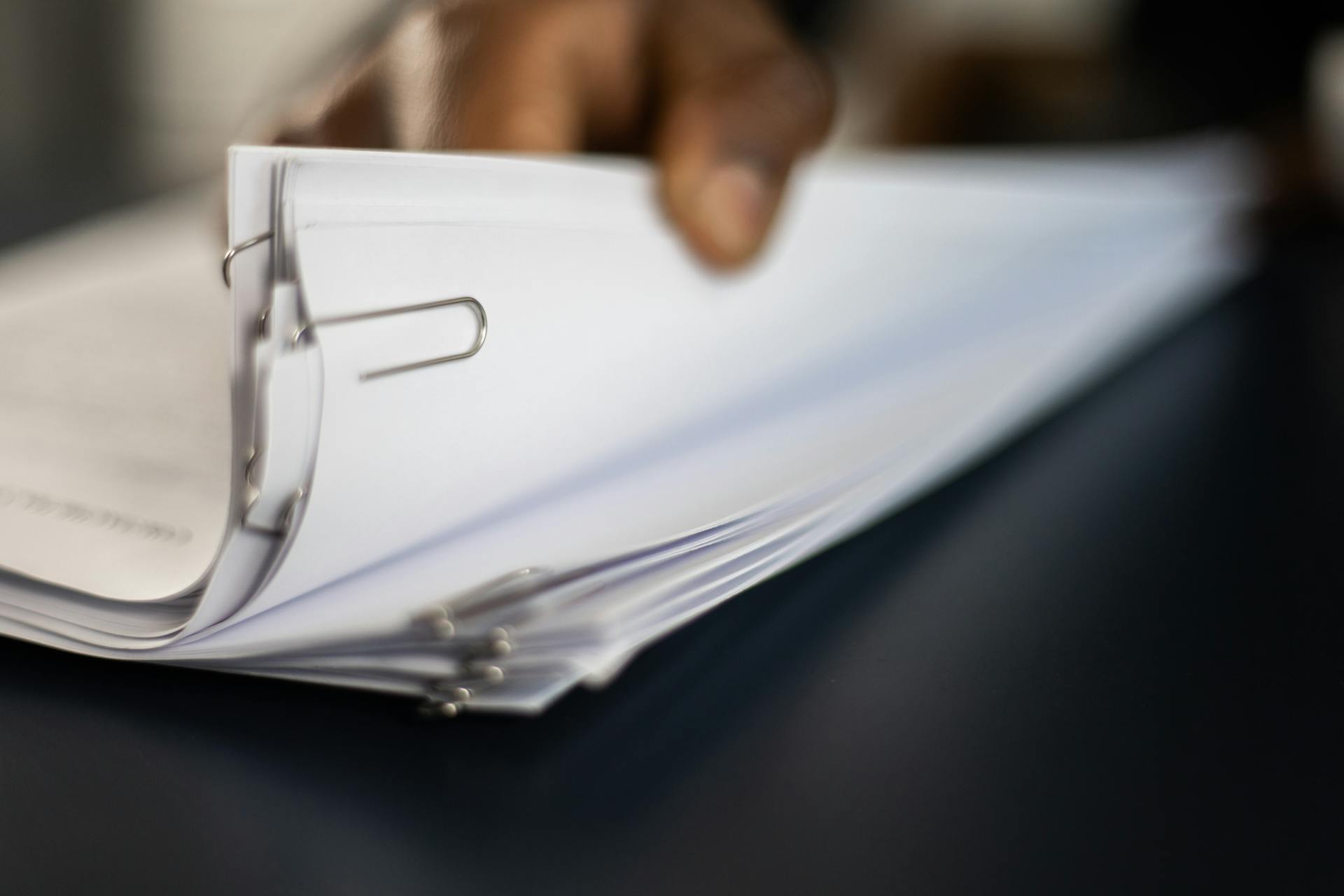 a4 paper documents stored in ring binder showing common office filing and printing usage of a4 paper wholesale.