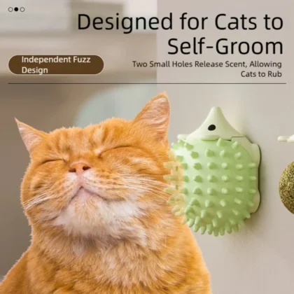 Cat rubbing against wall mounted catnip ball self groomer.